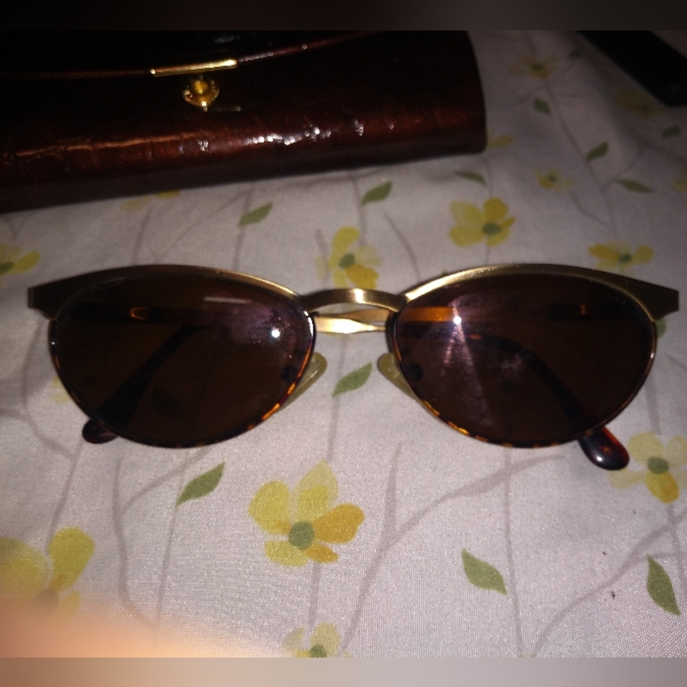 Revo Polarized Sunglasses with Purple Mirror Lens And UV Protection
